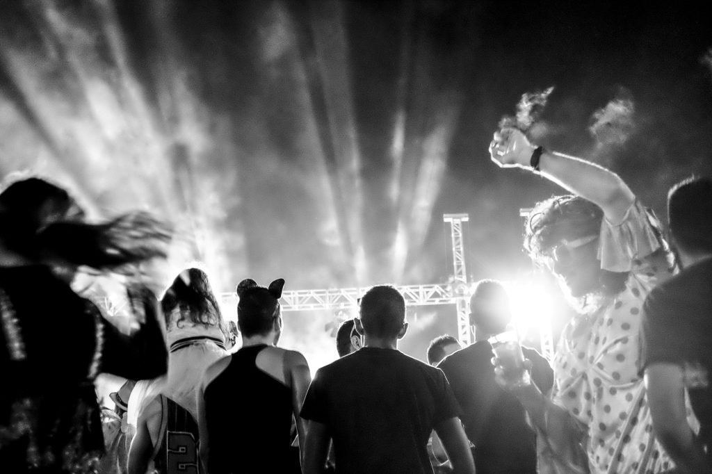 Live music concert with people with masks in carnival celebration on the stage - dj set and group